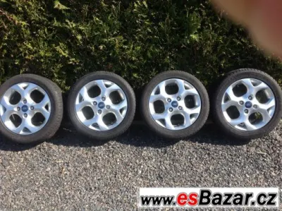 Alu kola Ford a letni pneu 195/50 R 15 82H
