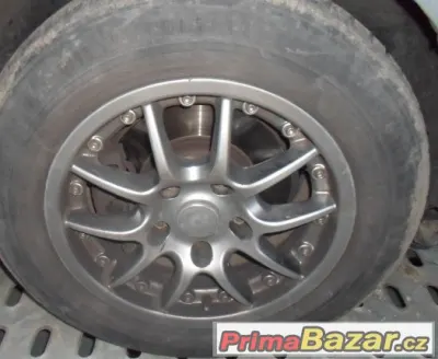 BMW - hliníková zimní kola 15"- pneu 60%