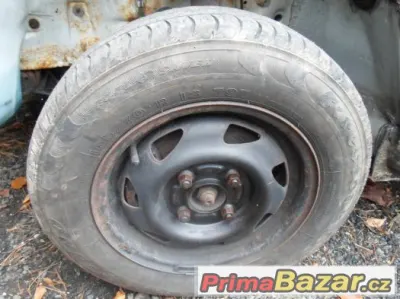 Ford - plechová kola 13" - pneu Firestone