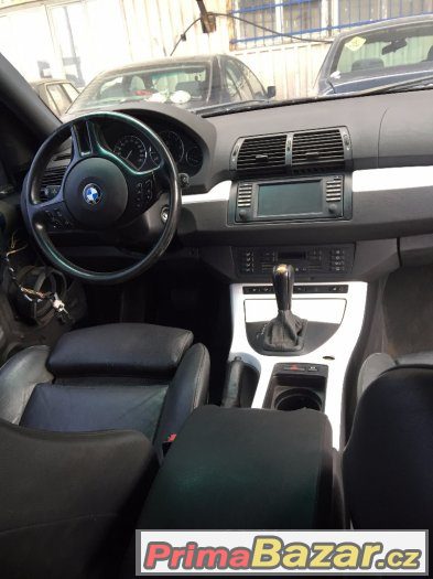 Černá stropnice, bílé lišty interieru BMW X5 E53 – fotografie 1